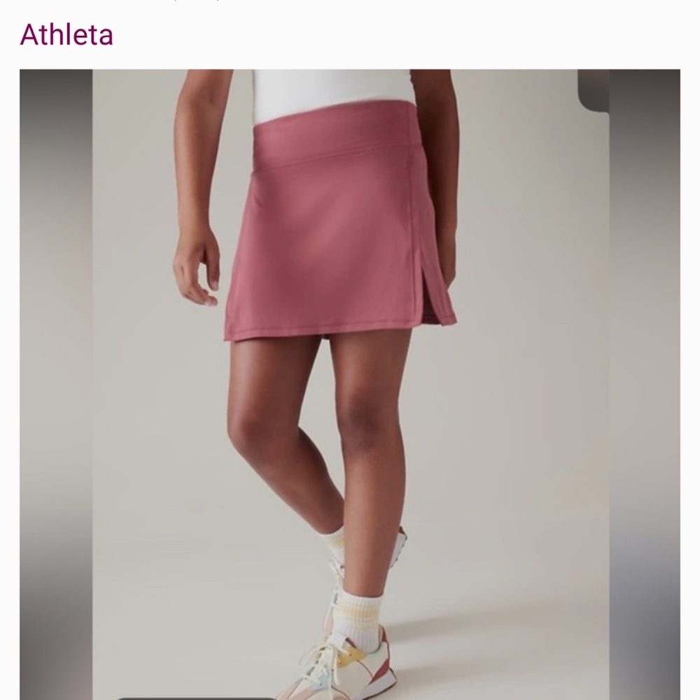 Athleta Girl Goal Getter Skort in dark Pink. Size s/7